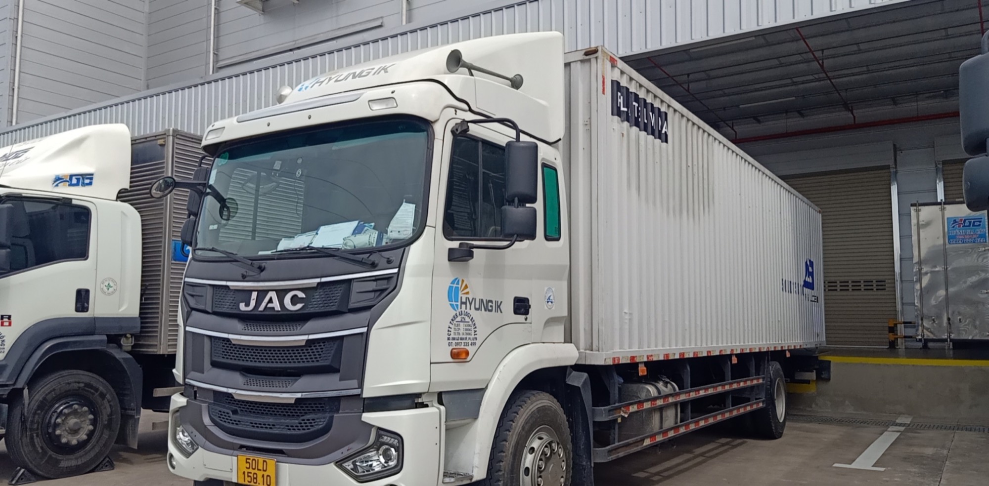 AB Logi truck at a warehouse dock in Ho Chi Minh City